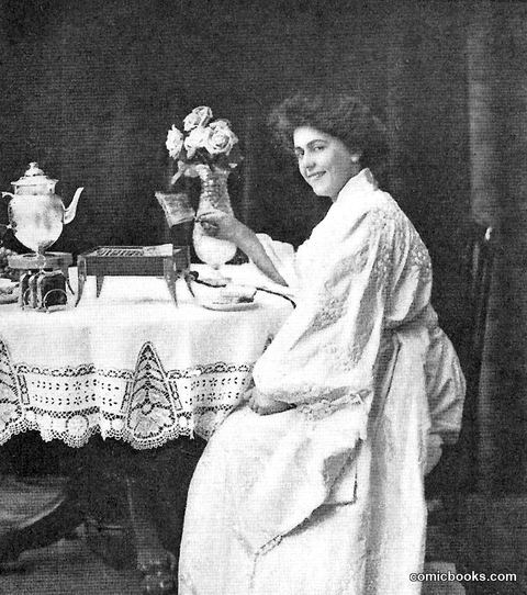 Woman at Breakfast Table with Electric Appliance